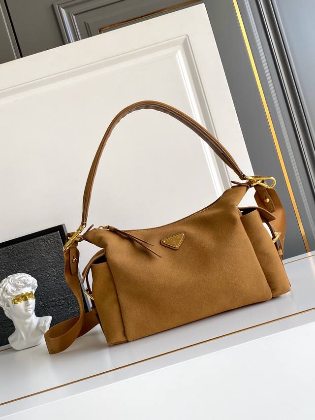 New Suede Explorer Bag This explorer bag is crafted from imported suede, featuri