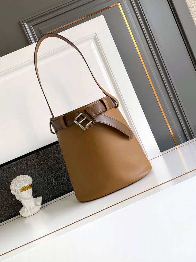 New Bucket Bag This stylish bucket bag offers a fresh take on the Buckle handbag