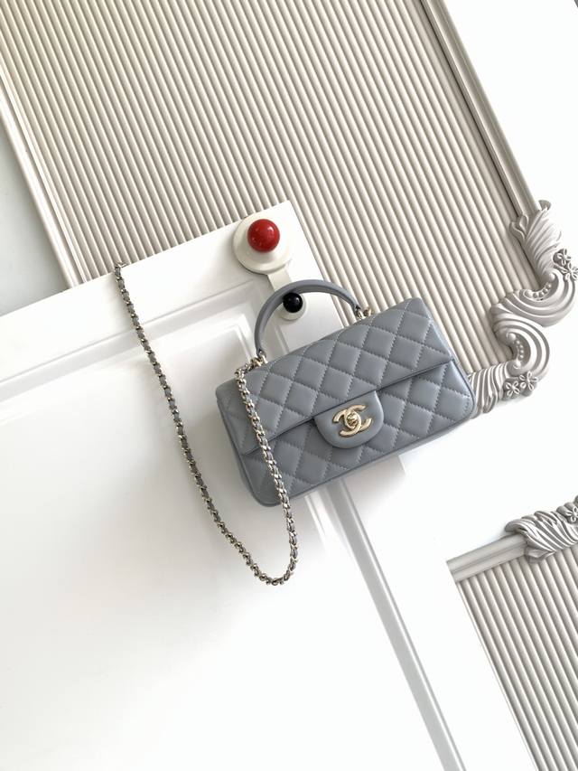Chanel 21K Latest Mini CF Handle Bag As2431. A classic quilted flap bag with a d