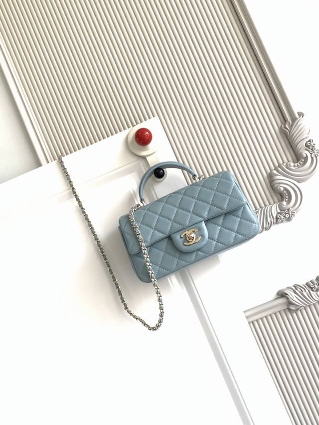 Chanel 21K Latest Mini CF Handle As2431. A classic quilted flap bag with a delic