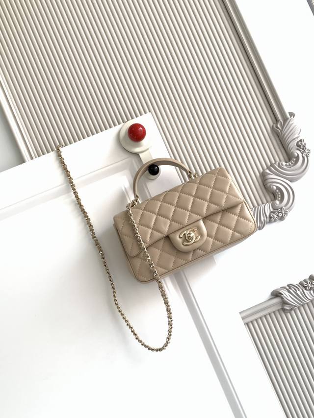 Chanel 21K Latest Mini Cf Handle Bag As2431. A classic quilted flap bag with a d