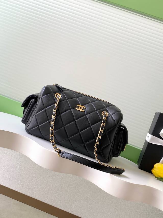 Chanel 25K lambskin bowling bag. The pebbled leather bowling bag with brushed ha