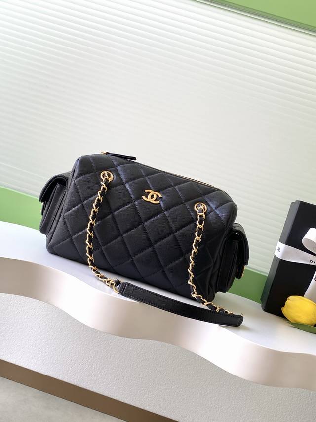Chanel 25K pebbled leather bowling bag. The pebbled leather bowling bag with bru