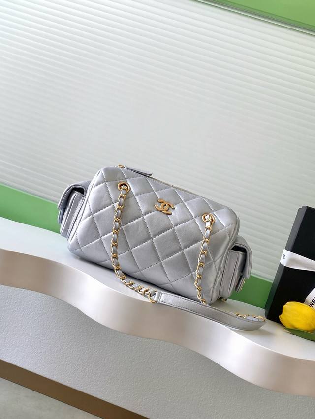 Chanel 25K lambskin bowling bag. The pebbled leather bowling bag with brushed ha