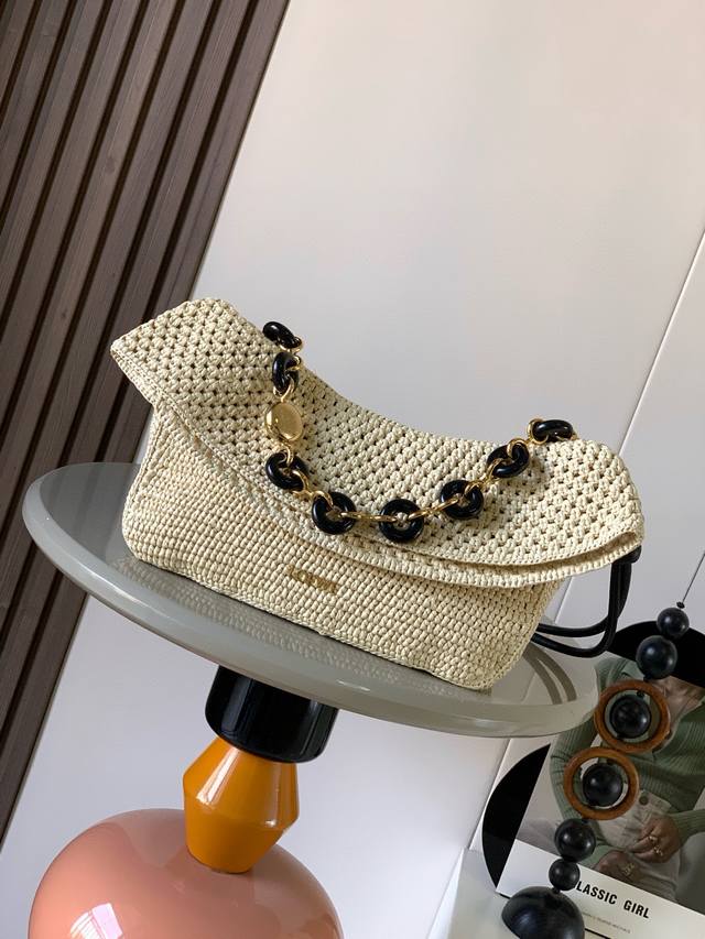 Medium Raffia and Wagyu Leather Ola Handbag. The Ola handbag, a celebrity favori