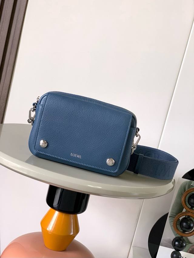 Small Soft Grained Calfskin Pebble Messenger Bag. This Pebble messenger bag feat