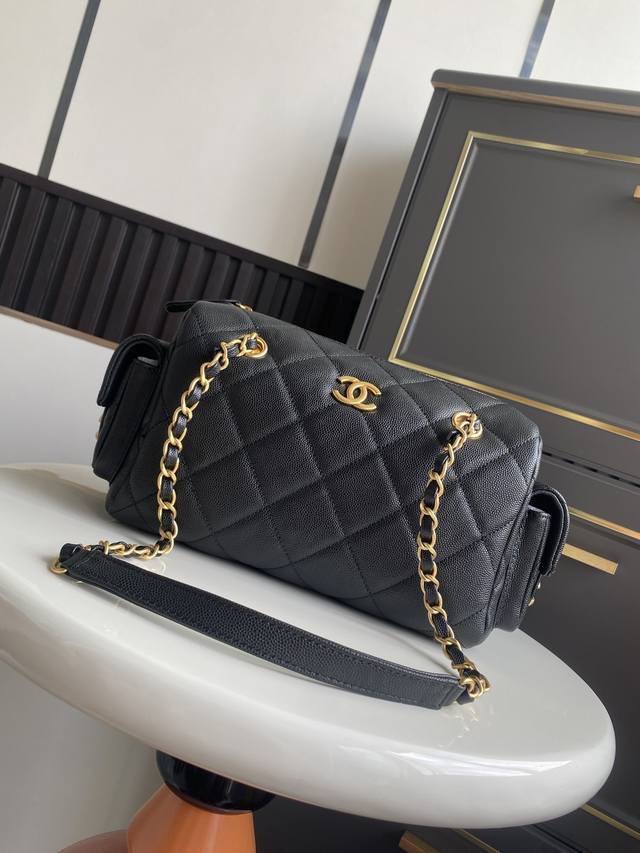 Small Chanel 25K Bowling Bag. The pebbled leather bowling bag with brushed hardw