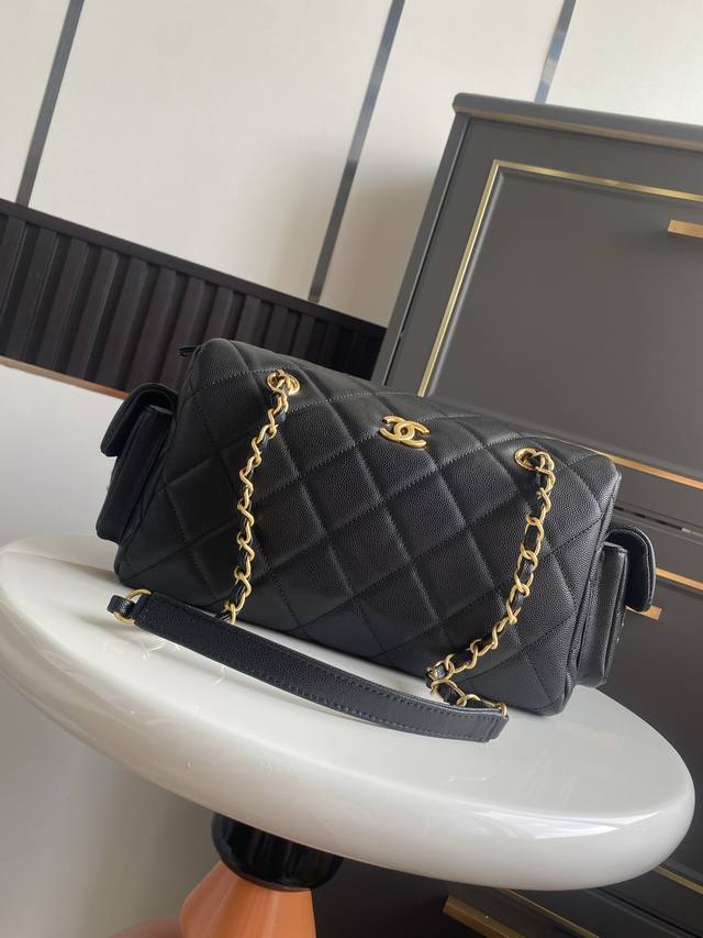 Large Chanel 25K Bowling Bag. The pebbled leather bowling bag with brushed hardw