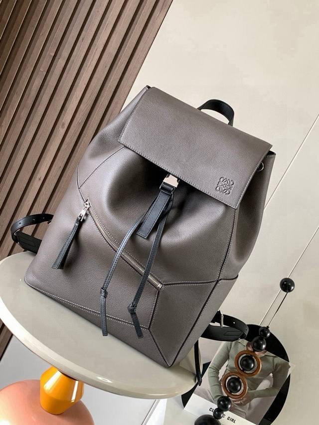 Puzzle Backpack - Soft Grained Calfskin Military Backpack. This spacious and ver