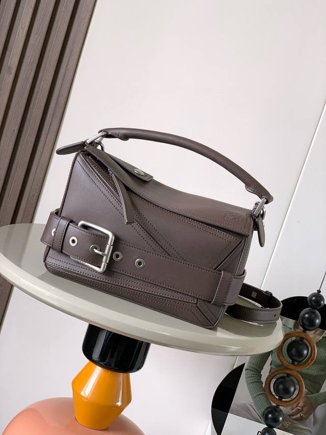 Small Glossy Calfskin Puzzle Biker Handbag. The Puzzle features a distinctive ge