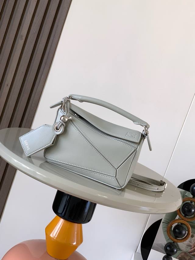 New version of the geometric mini Nappa lambskin Featherlight Puzzle handbag. Ma