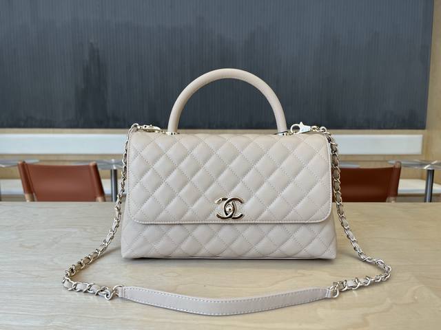 92991 Chanel Cocohandle bag with 14K light gold stitched lining, this season's C