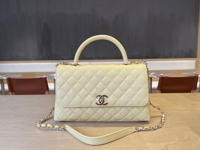 92991 Chanel Cocohandle bag with 14K light gold stitched lining, this season's C