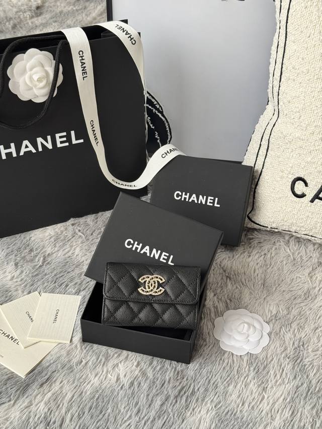 Chanel caviar cardholder with rhinestones, sparkling in the sunlight. The double