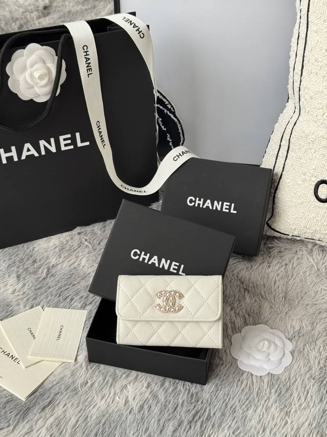 Chanel caviar cardholder with rhinestones, sparkling in the sunlight. The double