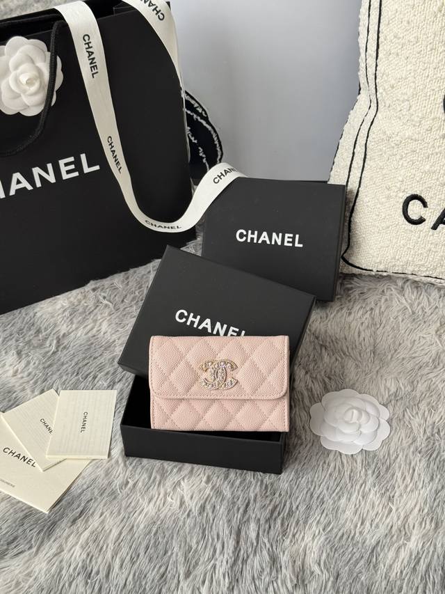 Chanel caviar cardholder with rhinestones, sparkling in the sunlight. The double
