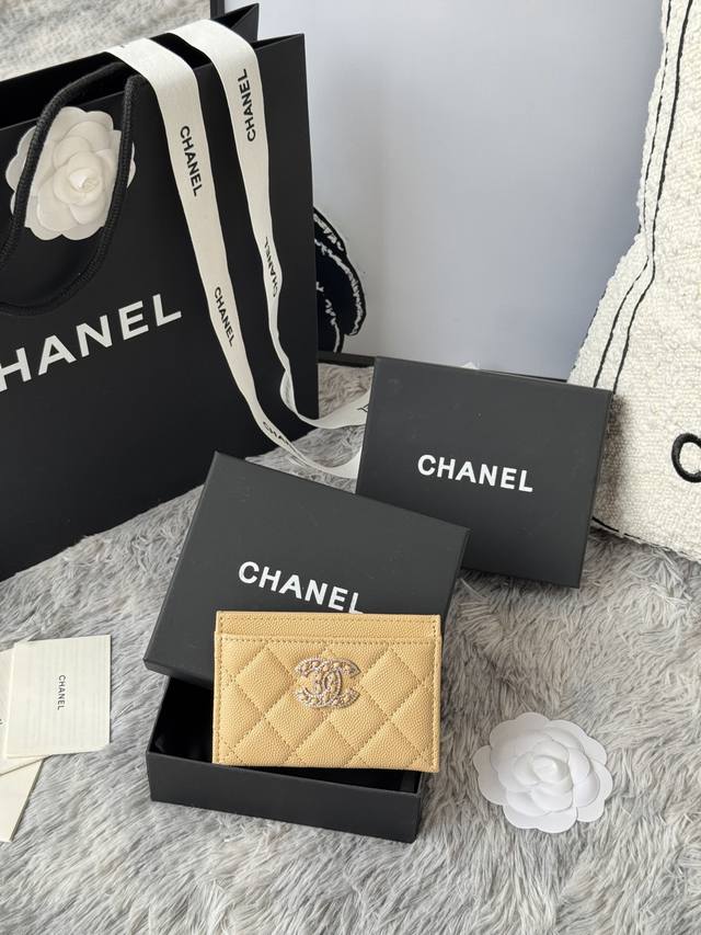 Chanel classic caviar card holder with rhinestones. The double C logo is exquisi