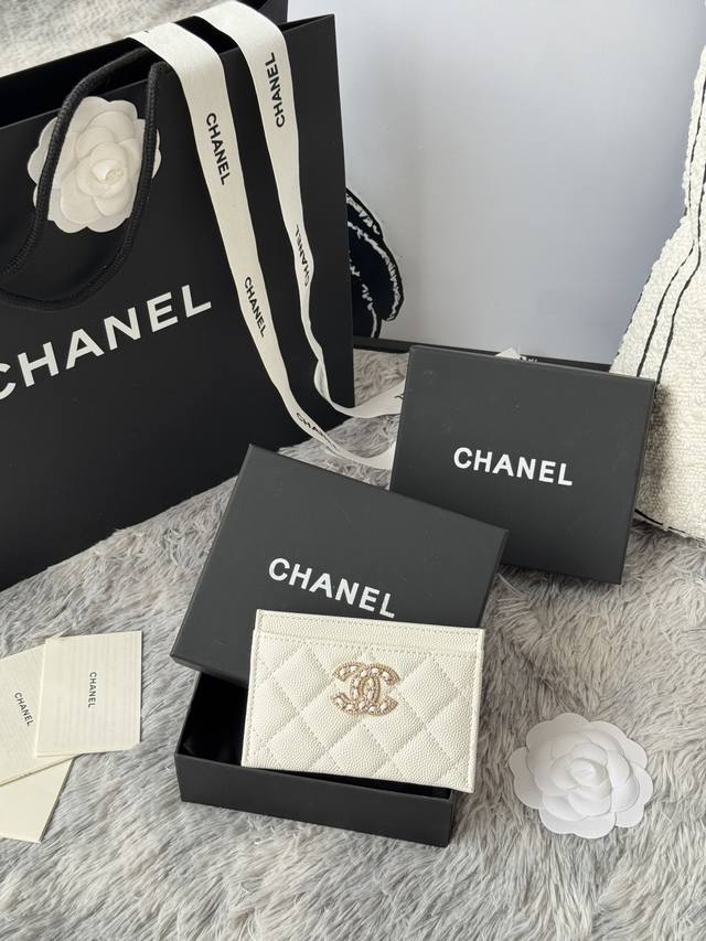 Chanel classic caviar card holder with rhinestones. The double C logo is exquisi