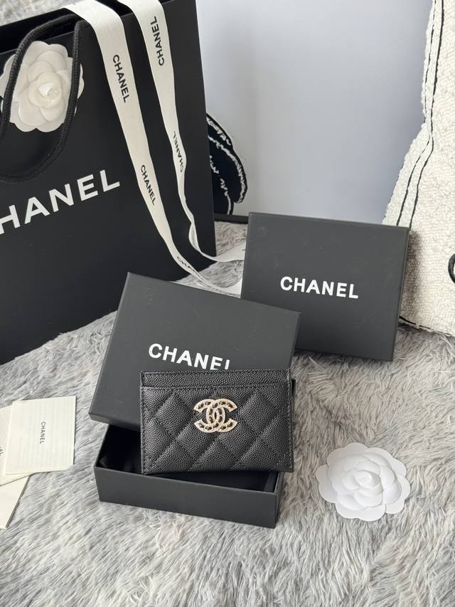 Chanel classic black caviar cardholder with rhinestones. The double C logo is ex
