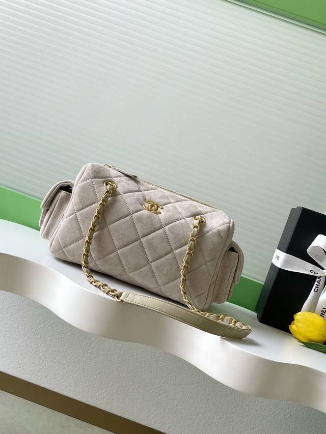Chanel 25K nubuck leather bowling bag. The pebbled leather bowling bag with brus