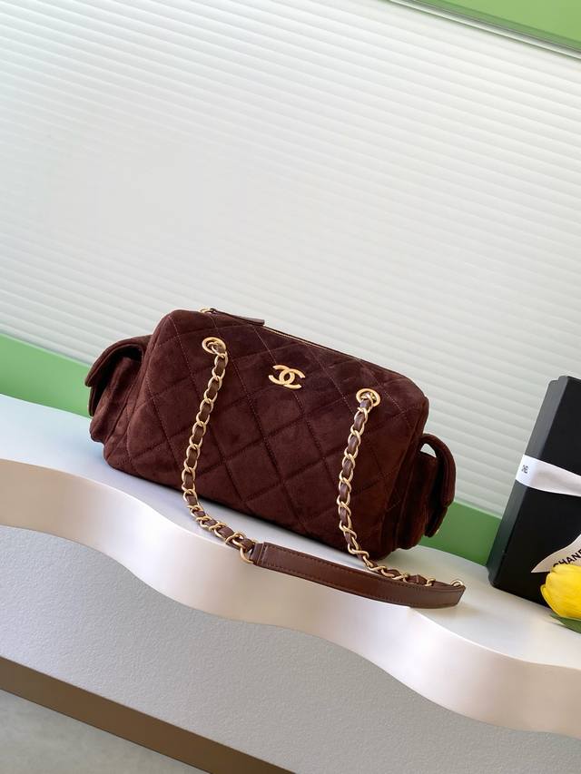 Chanel 25K nubuck leather bowling bag. The pebbled leather bowling bag with brus