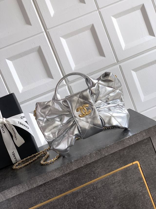 Top-tier original small size Ohanel bow bag in shimmering silver. Design and sty