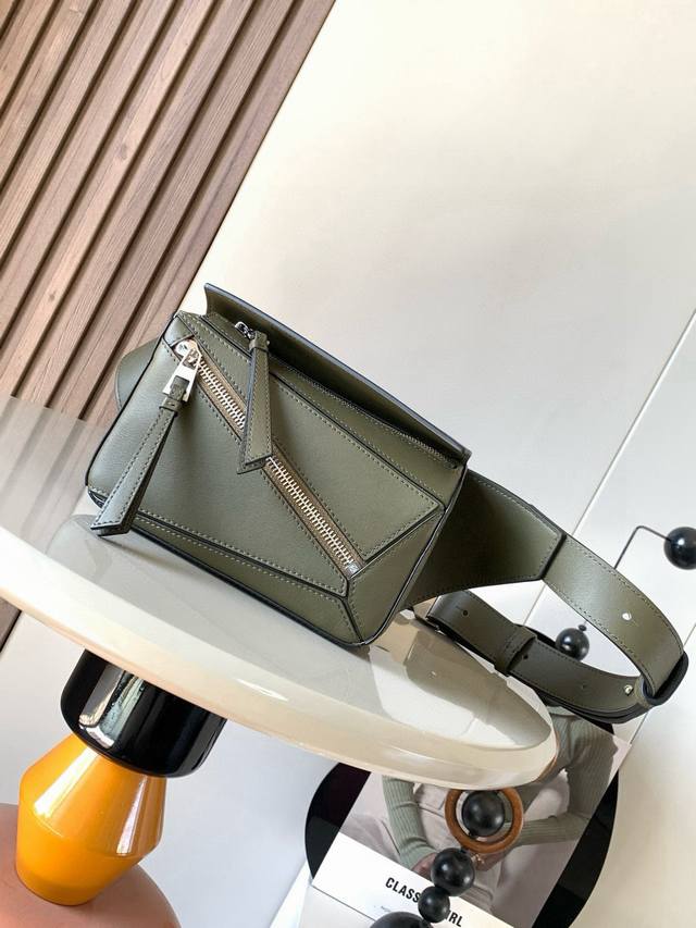 Mini Classic Cowhide Leather Puzzle Waist Bag. The rectangular shape and precise