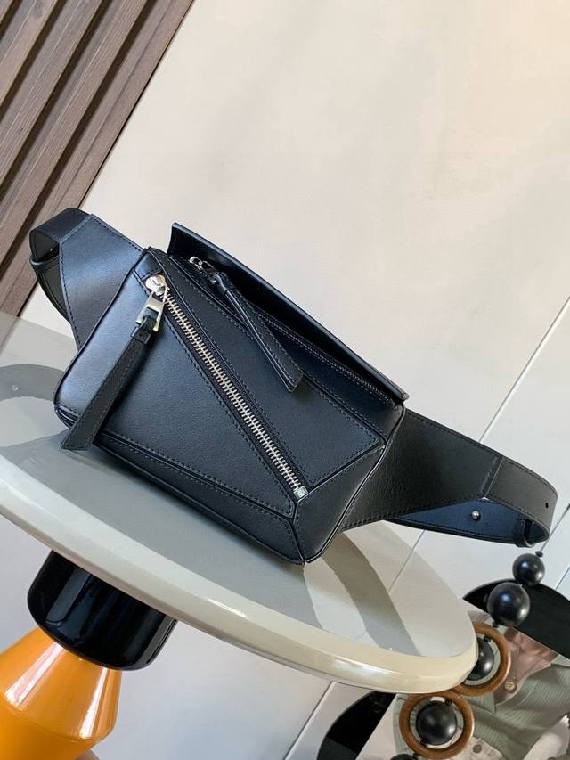 Mini Classic Cowhide Leather Puzzle Waist Bag. The rectangular shape and precise