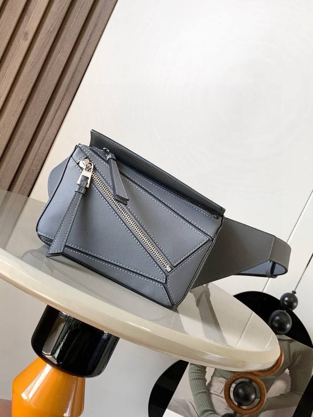 Mini Classic Cowhide Leather Puzzle Waist Bag. The rectangular shape and precise