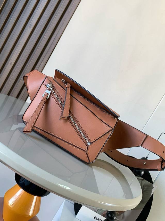 Mini Classic Cowhide Leather Puzzle Waist Bag. The rectangular shape and precise