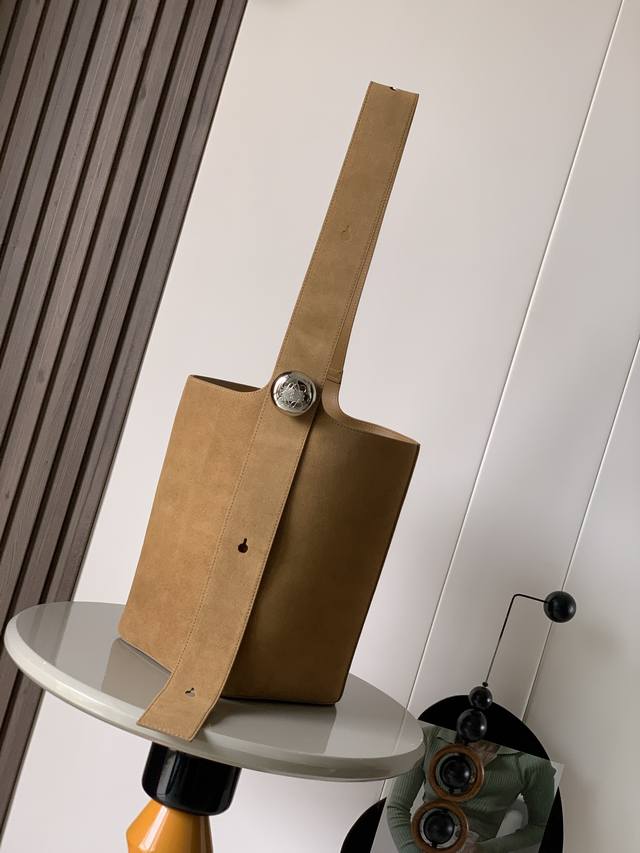 New Large Pebble Bucket Bag in Suede Cowhide Leather. The Pebble cleverly blends
