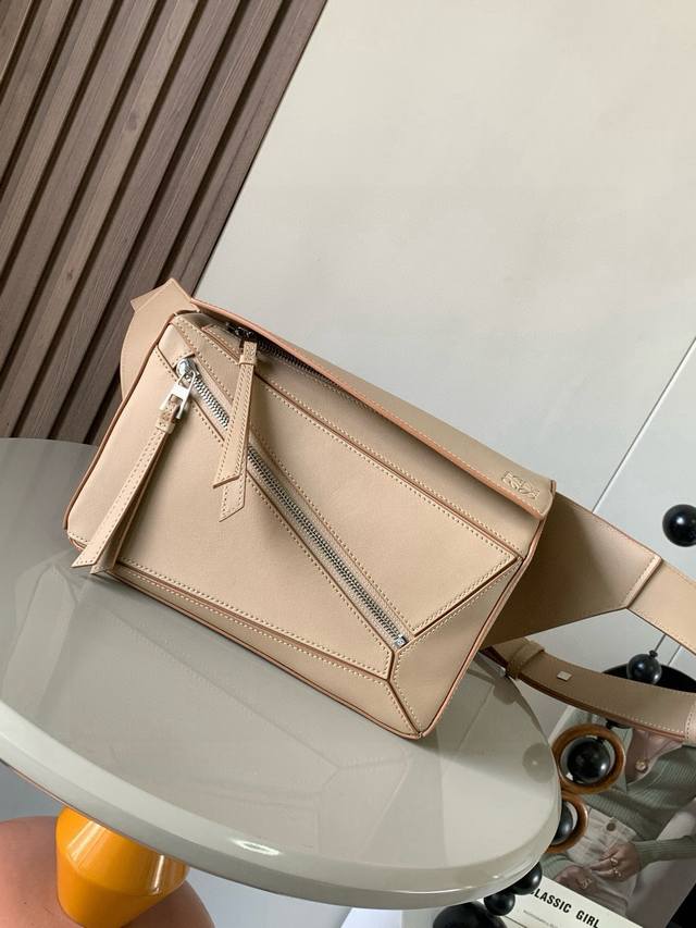 Small Classic Calfskin Puzzle Waist Bag. The rectangular shape and precise cutti