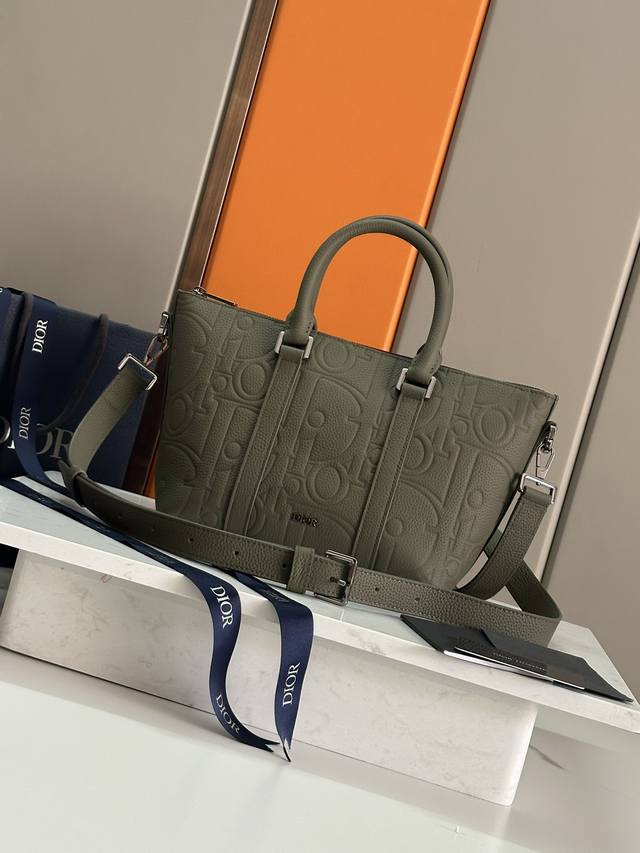 Authentic Dior Weekender 25 handbag features a classic and elegant design. The D