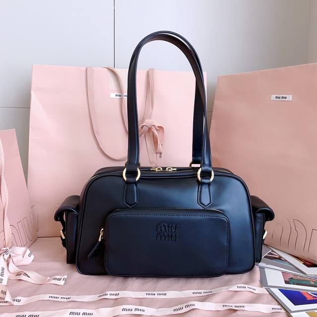5Bb179, Miu's new vintage motorcycle bag, featuring a distinctive design. Made w