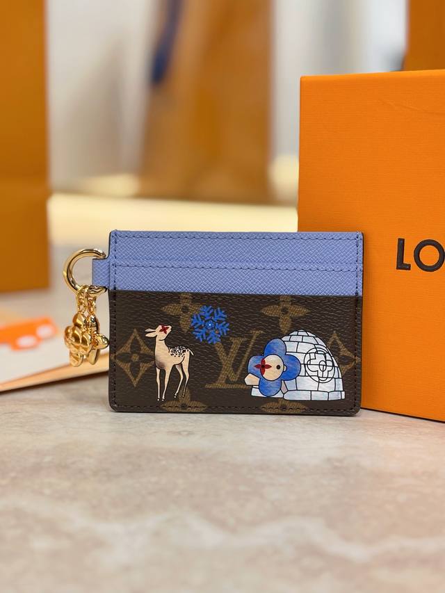 M15324 Christmas Card Holder Wallet Series Lv Charms Card Holder features the ic