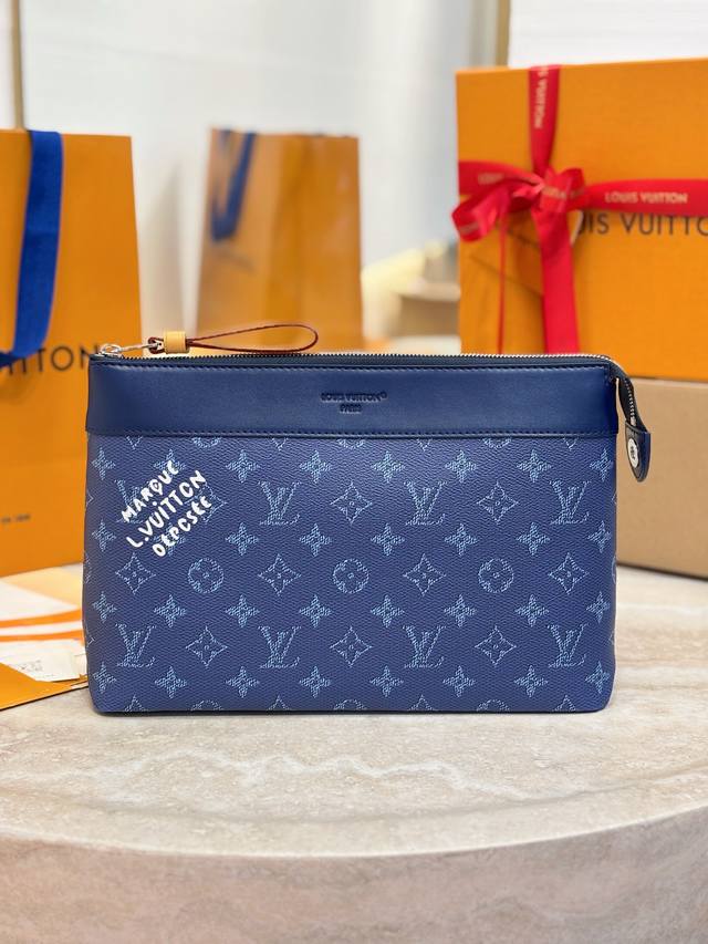 Top-tier replica M12665 Blue Pochette Voyage Souple Clutch. This Pochette Voyage
