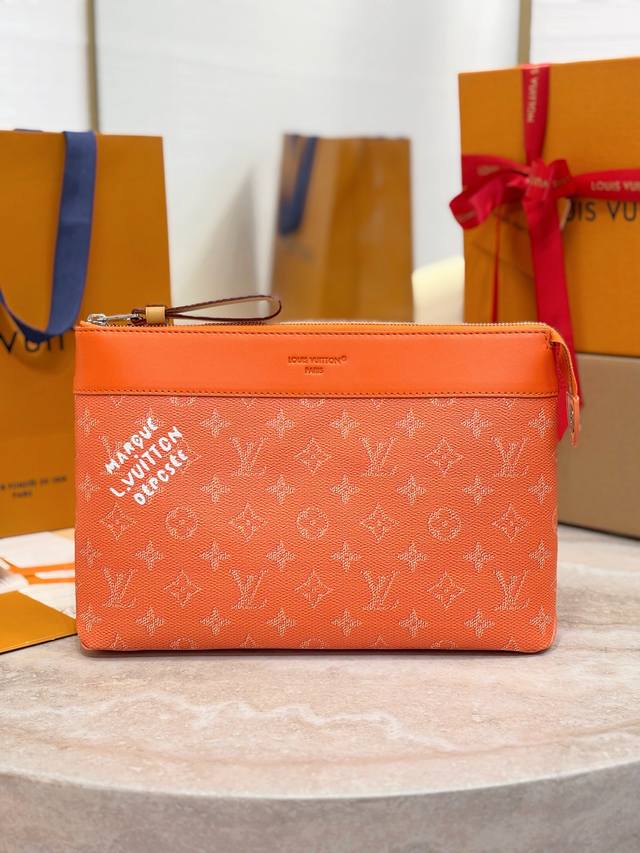 Top-tier replica M12665 Orange Pochette Voyage Souple Clutch. This Pochette Voya