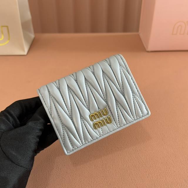 Comes with full boutique packaging. Latest version of the Mm pocket wallet, new