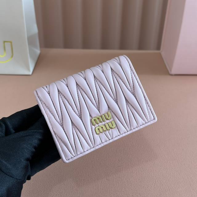 Comes with full boutique packaging. Latest version of the Mm pocket wallet, new