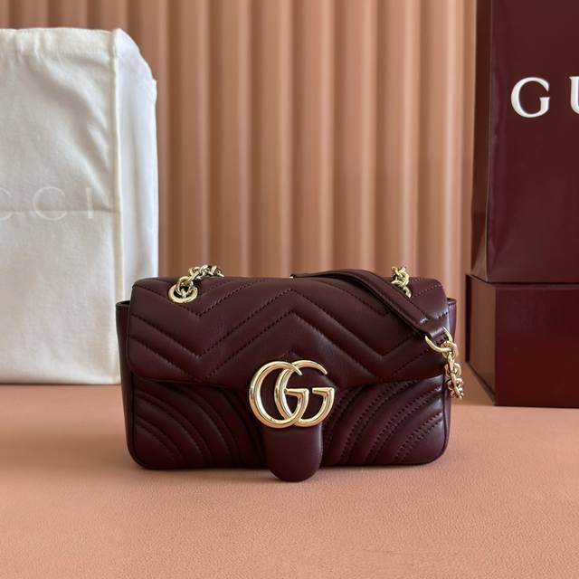 Features the brand's iconic GG Marmont series, crafted with double-G shaped hard