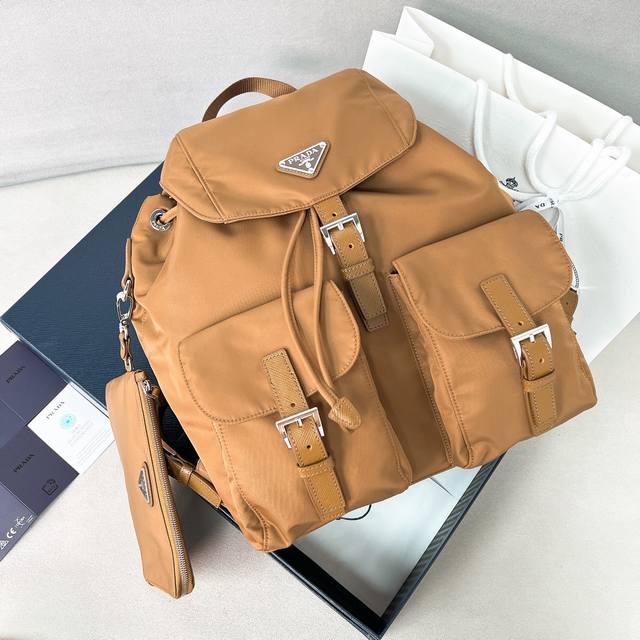 New Backpack 1Bz811 This nylon backpack features exquisite Saffiano leather trim