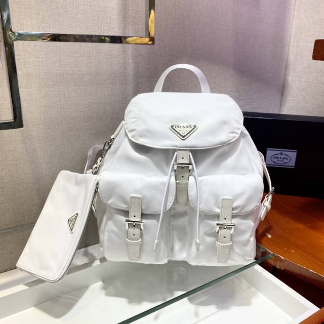 New Backpack 1Bz811, New Color. This nylon backpack features exquisite Saffiano