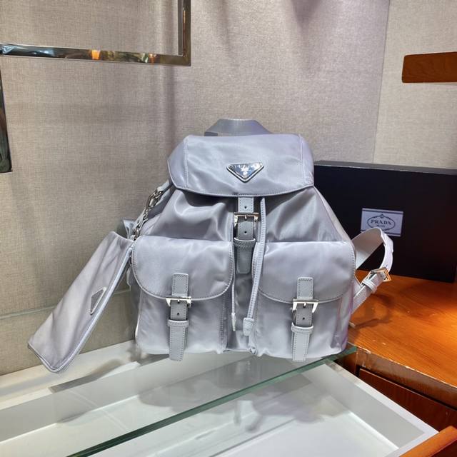 New Backpack 1Bz811, New Color. This nylon backpack features exquisite Saffiano