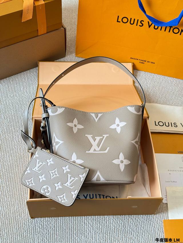 The LV All Inbb handbag in Monogram calfskin leather features polished metal har
