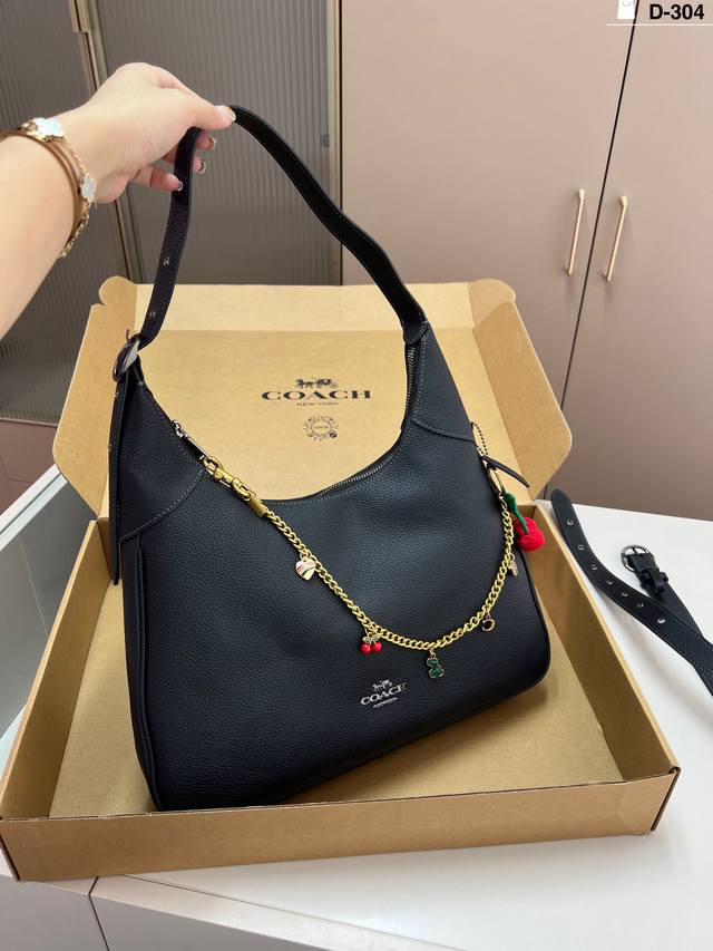 Coach Brooklyn Shoulder Bag with Charm This Brooklyn shoulder bag features an el