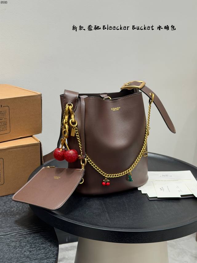 Comes with a box and chain charm! Includes a cherry pendant! Size: 26*28cm. Coac