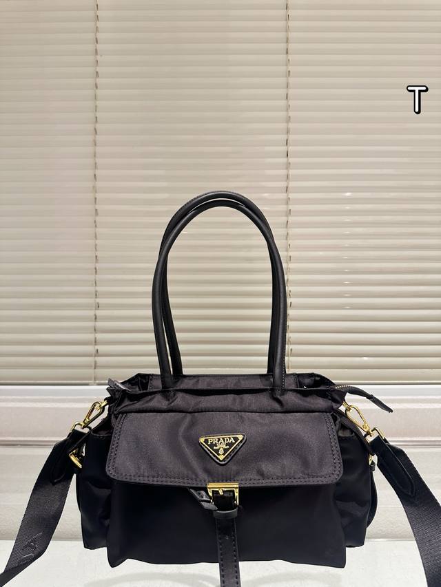 Prada Explore Nylon Tote Bag This Prada Explore tote bag is made of Re-Nylon and