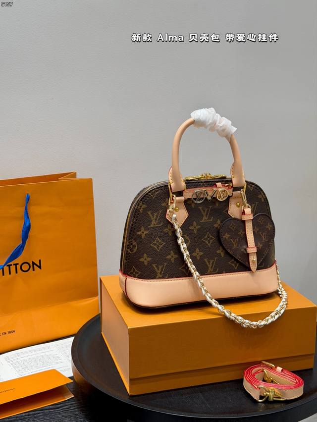 Comes with box. Size: 25*18cm. New LV Alma shell bag handbag with heart charm! W