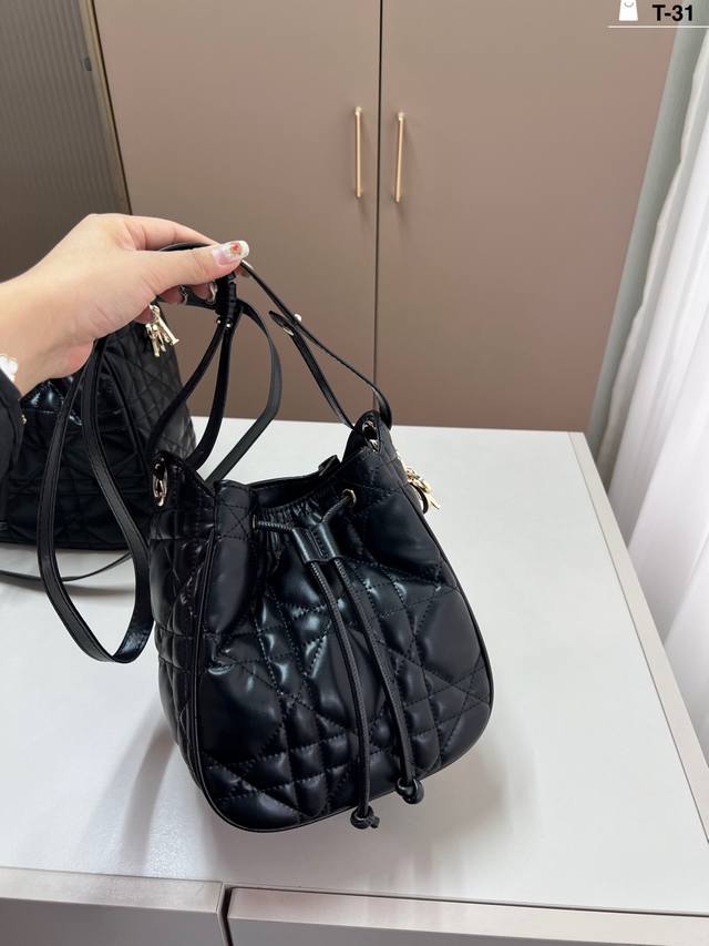 Dior's stylish and practical bucket bag features a unique design. It comes with