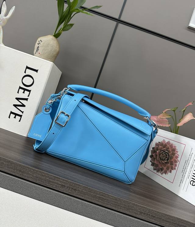 Low's new small Nappa lambskin Featherlight Puzzle handbag features a distinctiv